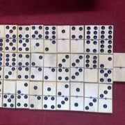 Set of complete dominoes made of bone, nails and blackened wood