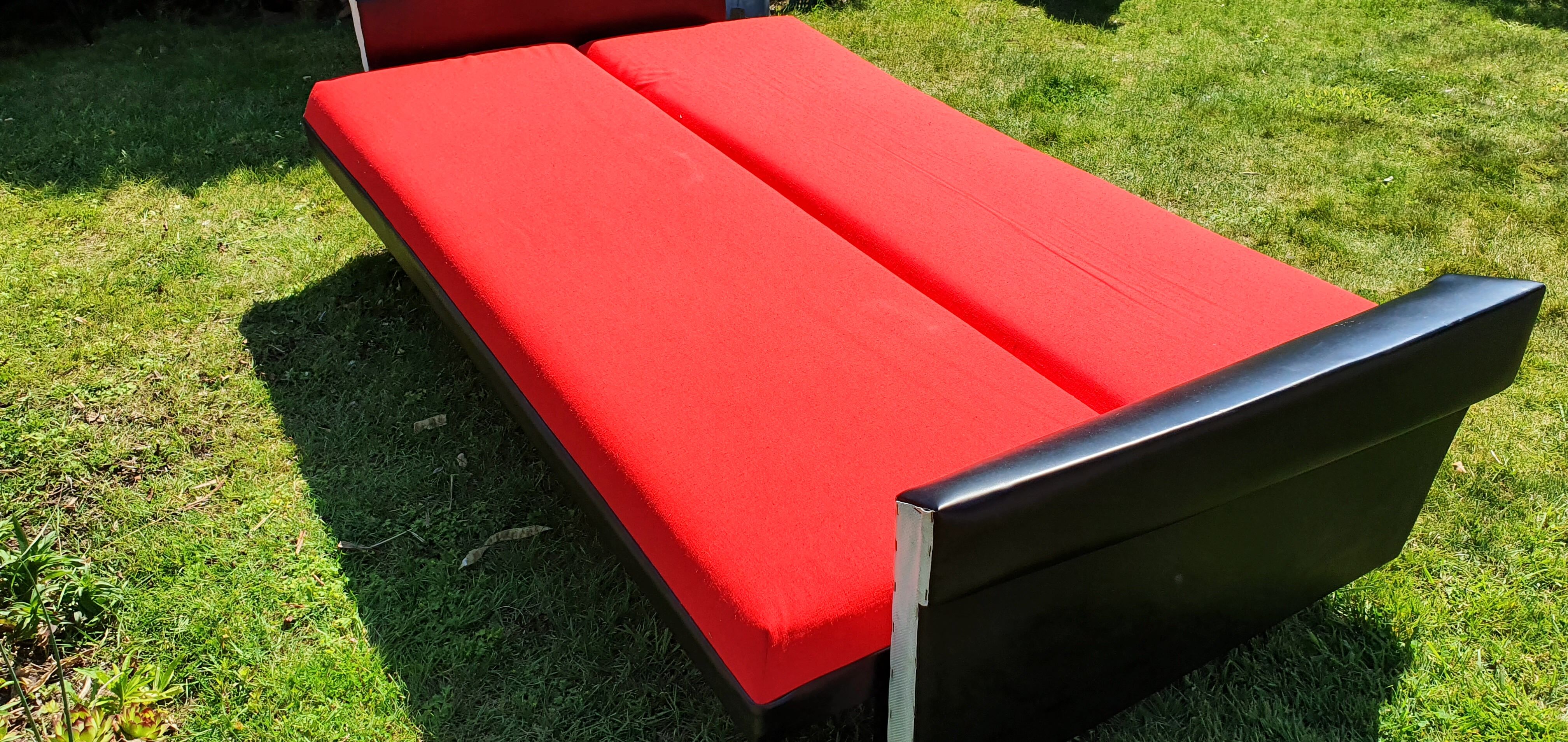 Vintage sofa 3 places convertible, red fabric and black skaï.1960s.