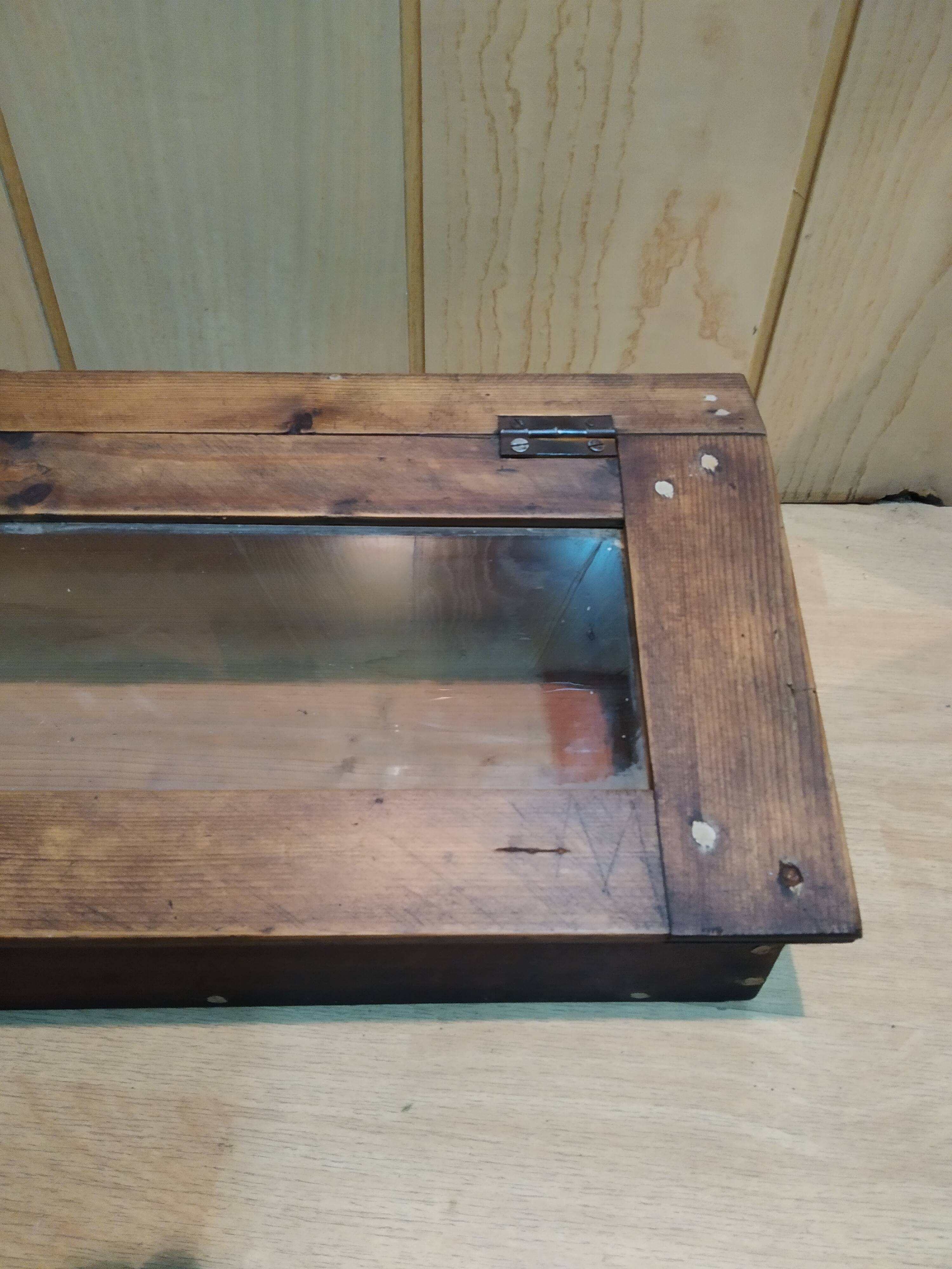 Former wooden display case