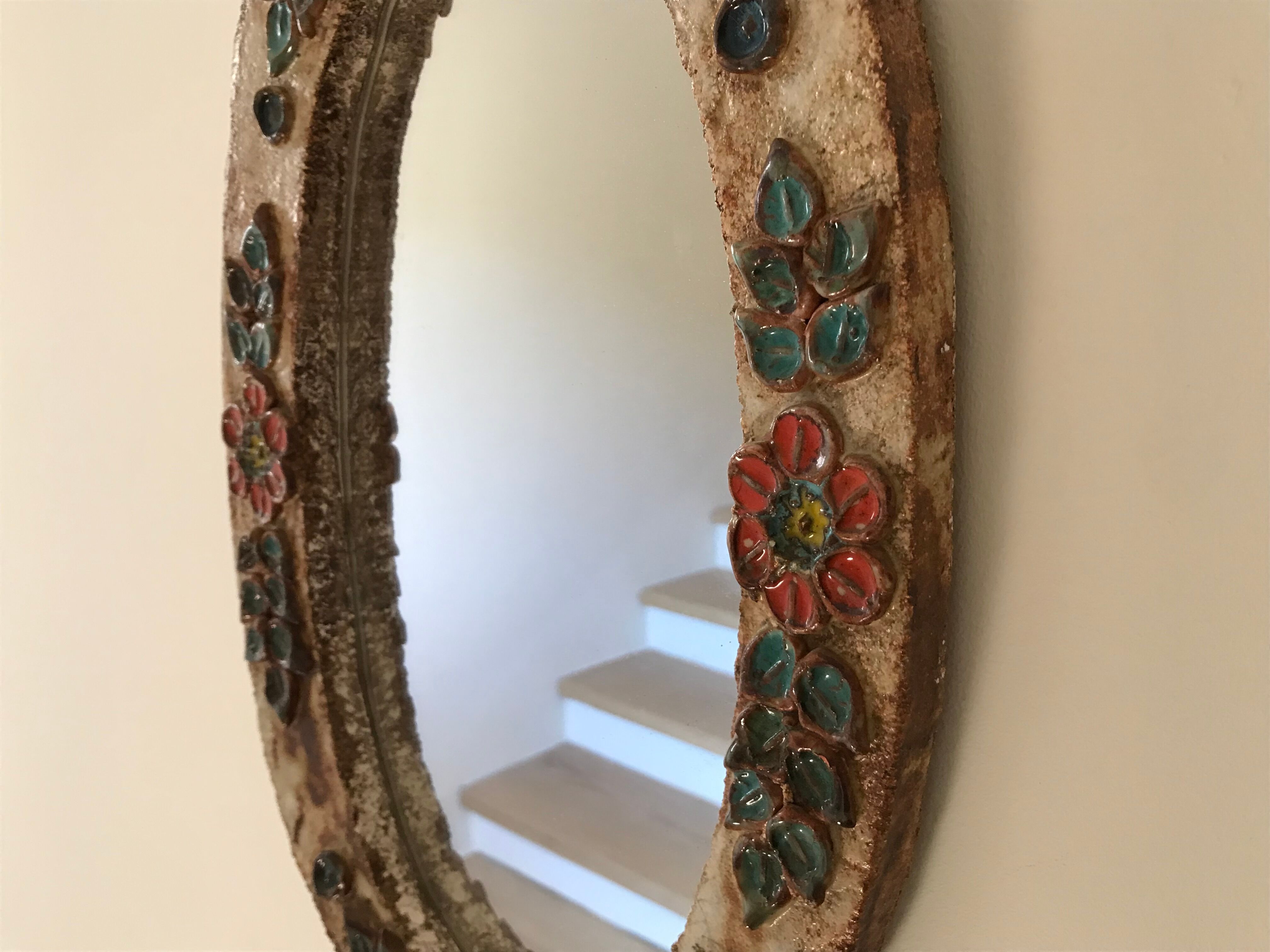 Ceramic mirror decorated with flowers, circa 1960 25x40cm