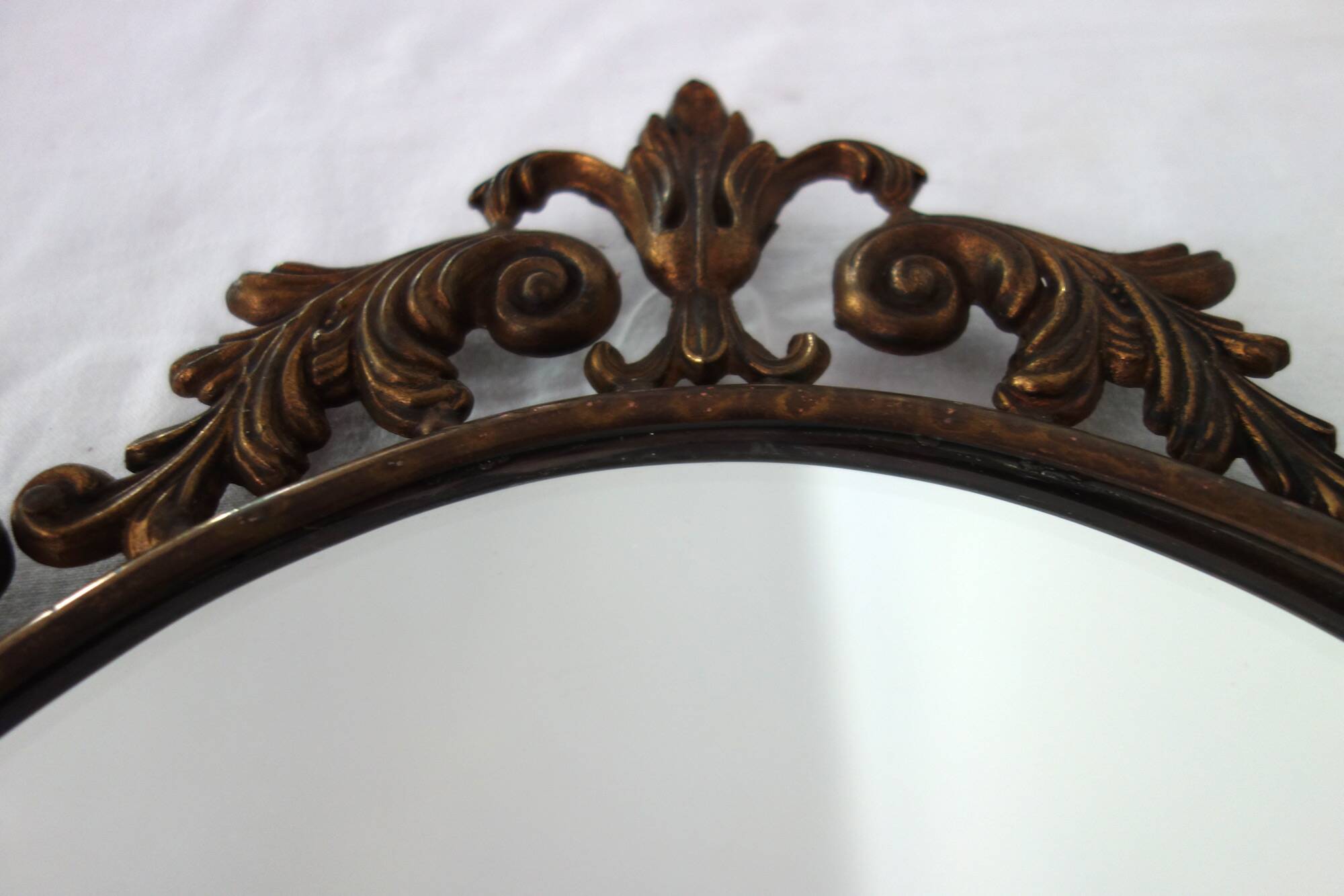 Antique oval art deco brass mirror