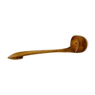 Small raw wooden skimmer ladle