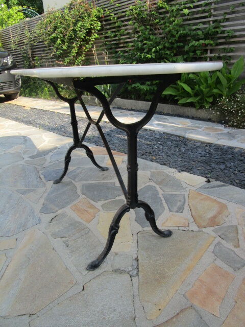 Antique marble bistro table and cast iron foot