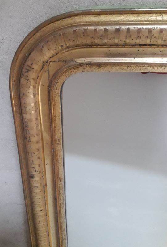 Golden Louis Philippe mirror H122xW84cm with gilded motifs.
