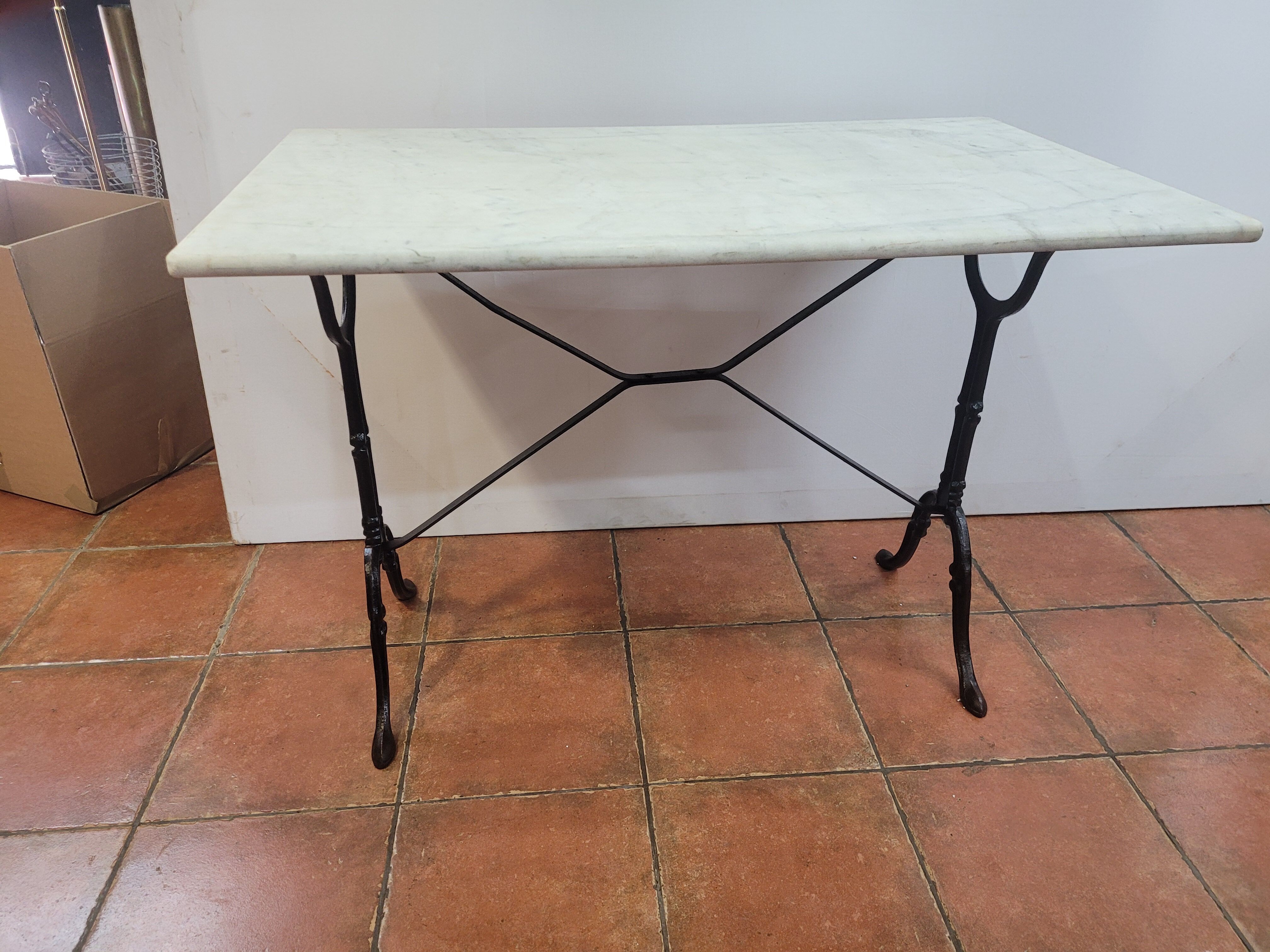Bistro table base cast iron over marble