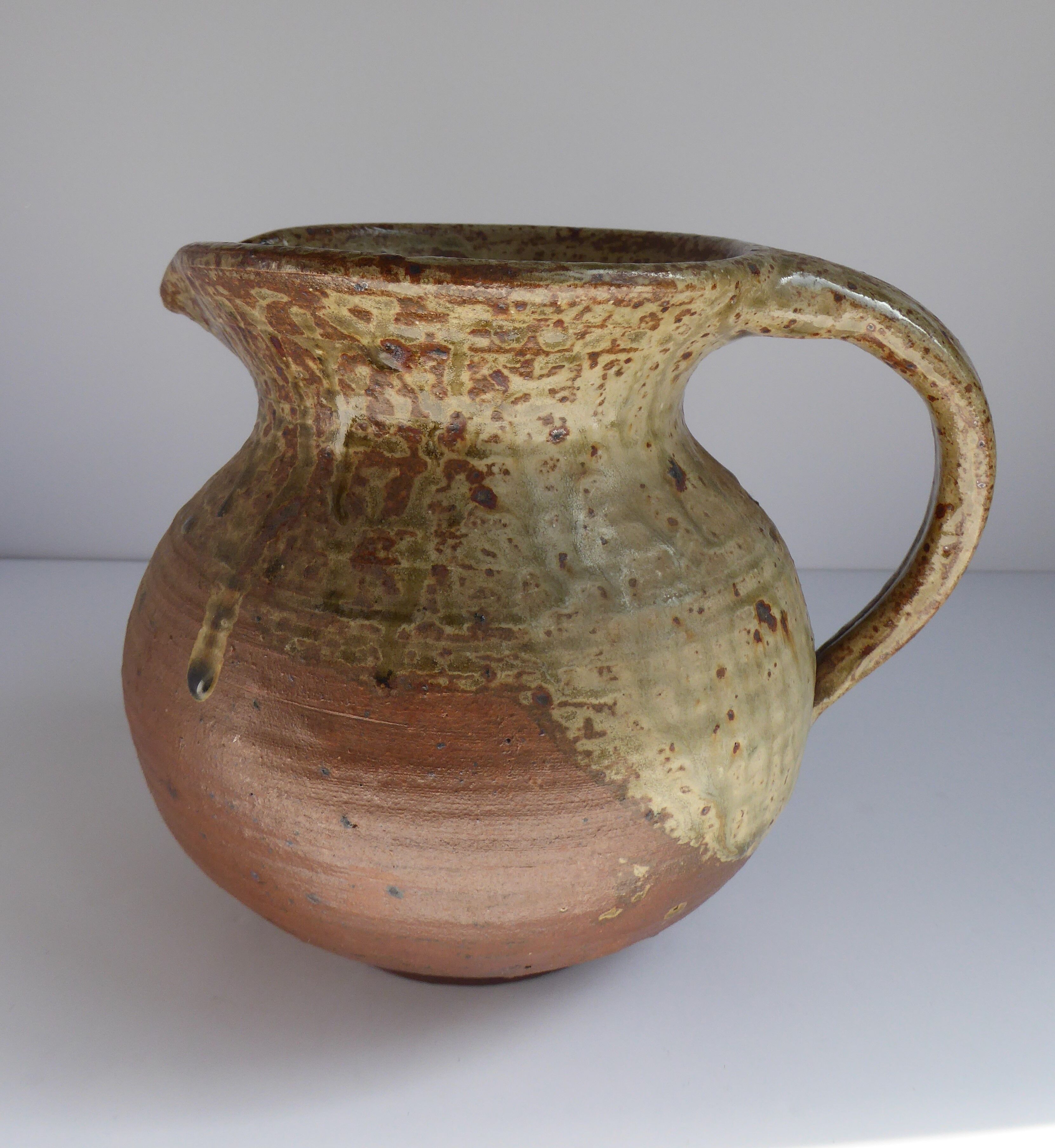 Signed vernissé sandstone pitcher