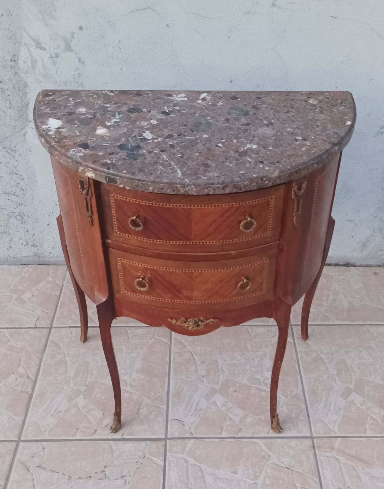 Half-moon commode in Louis XV style with walnut veneer.