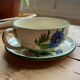Large cup and saucer in the quimper earthenware style.