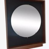 Scandinavian mirror with wooden frame and backlighting.