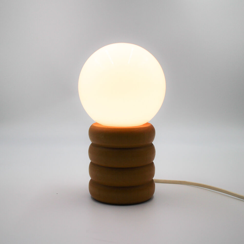 Vintage globe lamp on wooden base