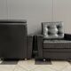 2 Black leather arm chairs 1960s on wheels