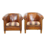 Set of 2 cognac-colored sheepskin club chairs with colorful fabric cushions