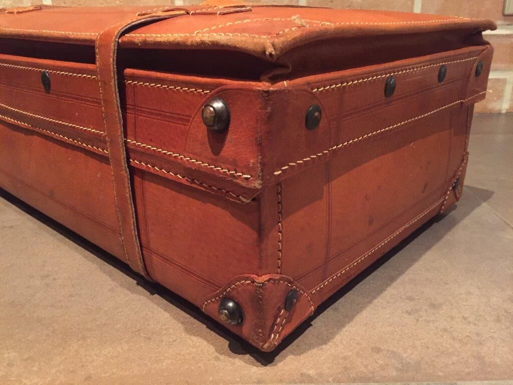 Thick leather suitcase