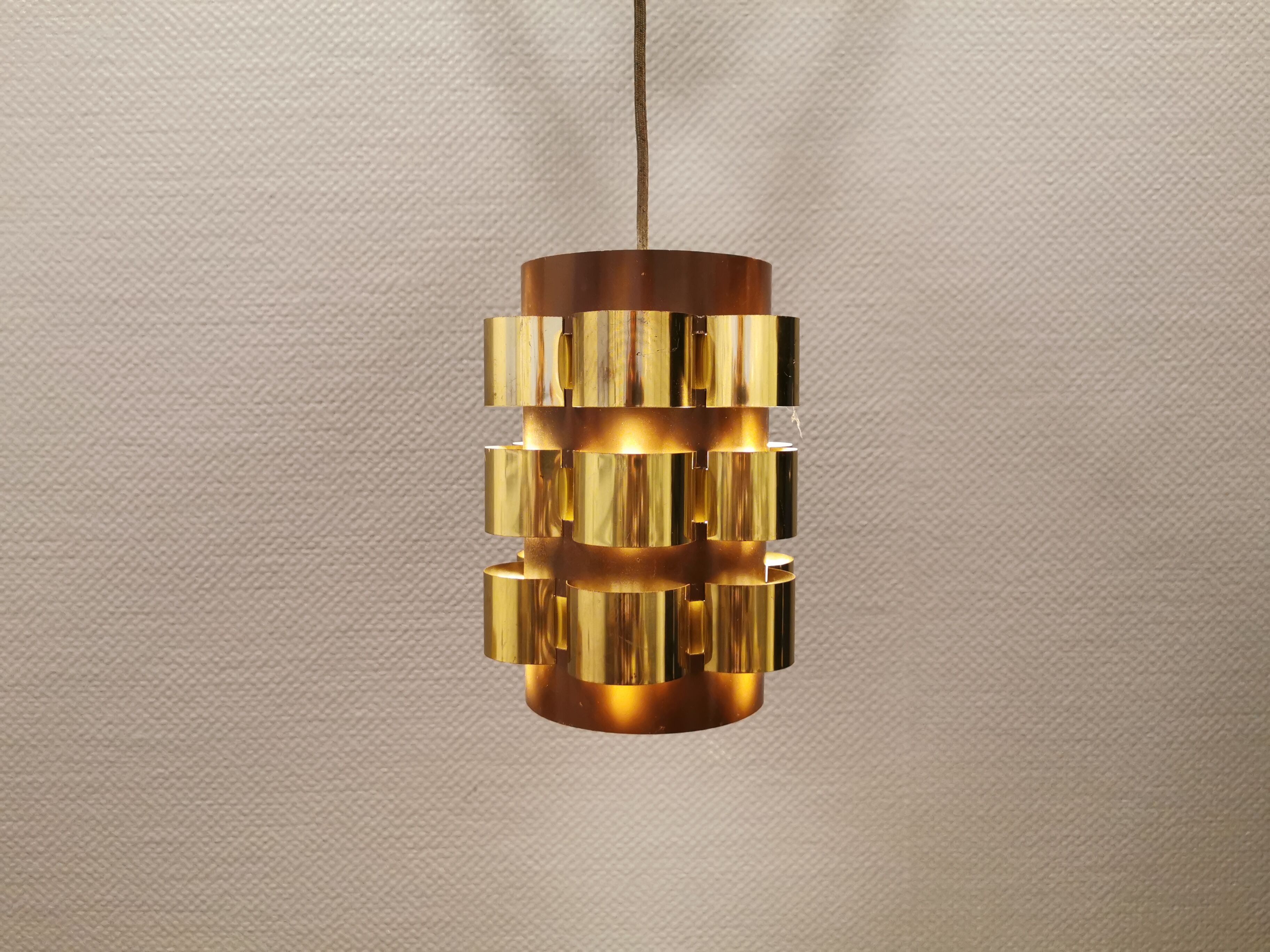 Danish hanging lamp from the 70s, in thin cut metal.