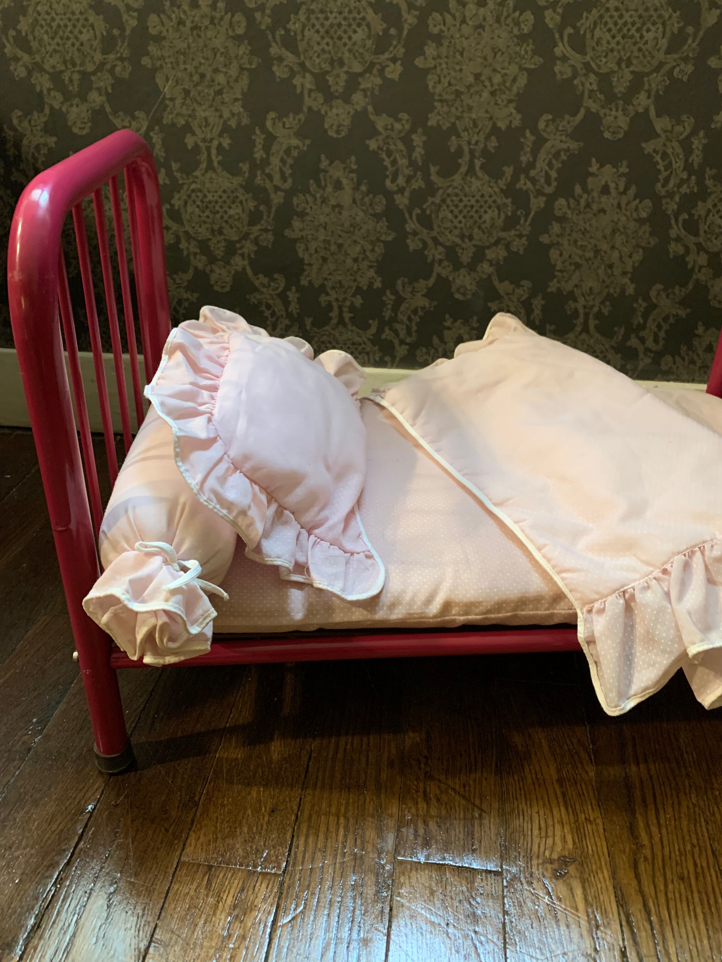 pink metal doll bed