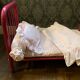 pink metal doll bed