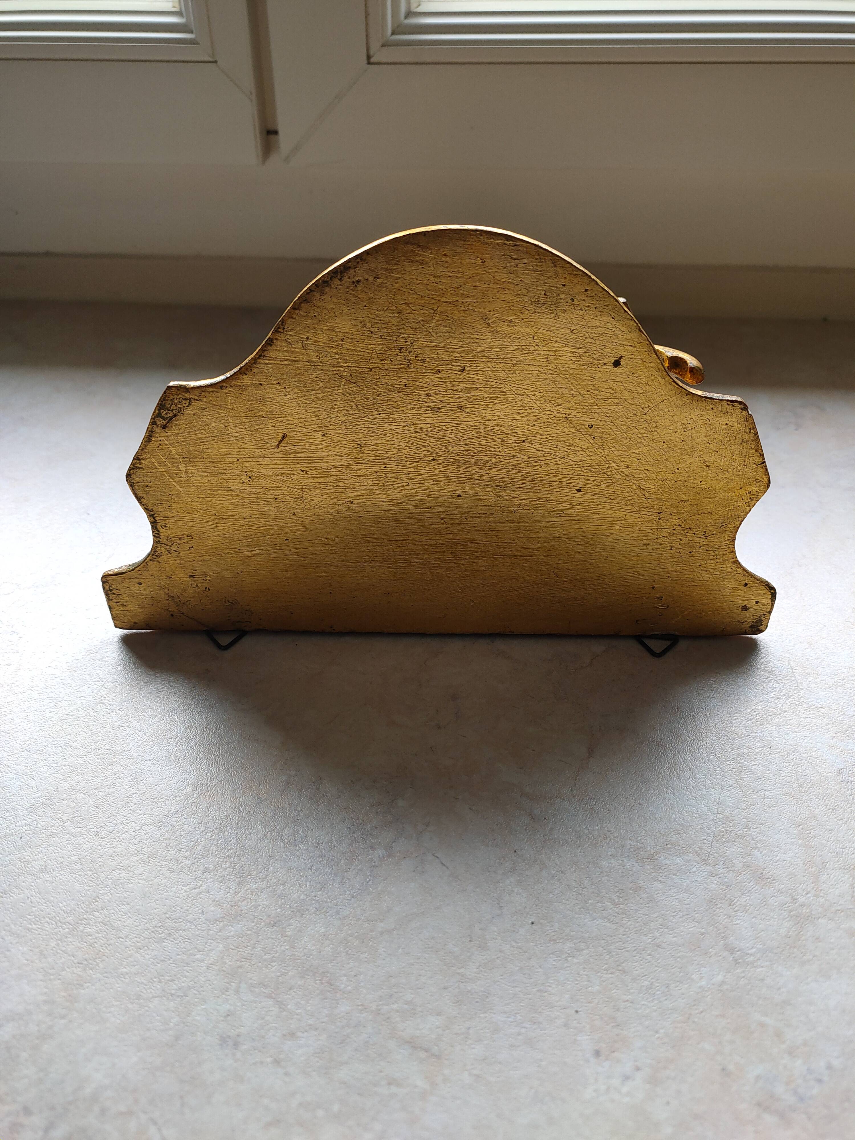 Baroque style golden shelf.