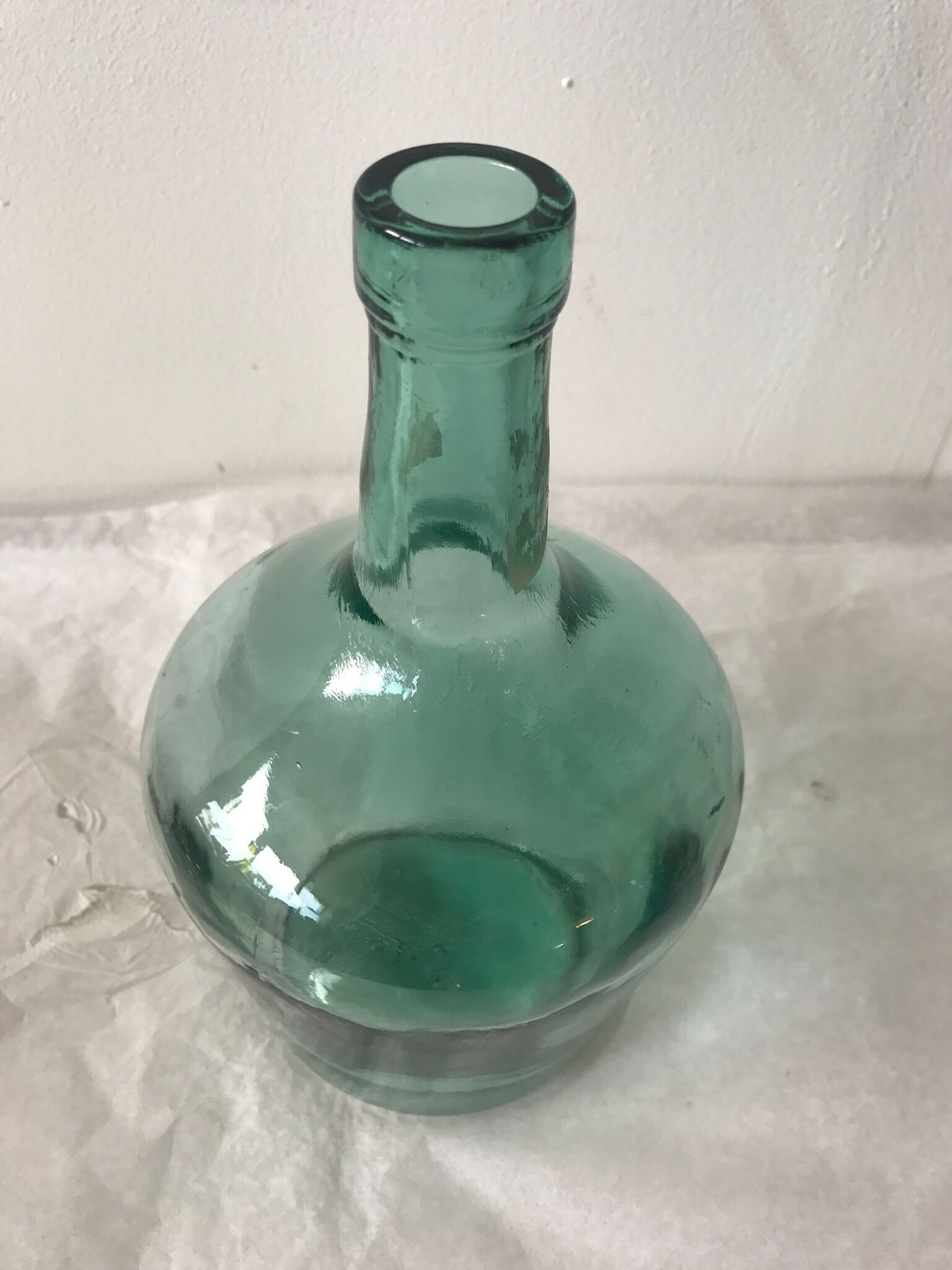 Dame jeanne en verre vert d'eau
