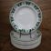 11 white and green earthenware soup plates from Saint Amand Terre de Fer