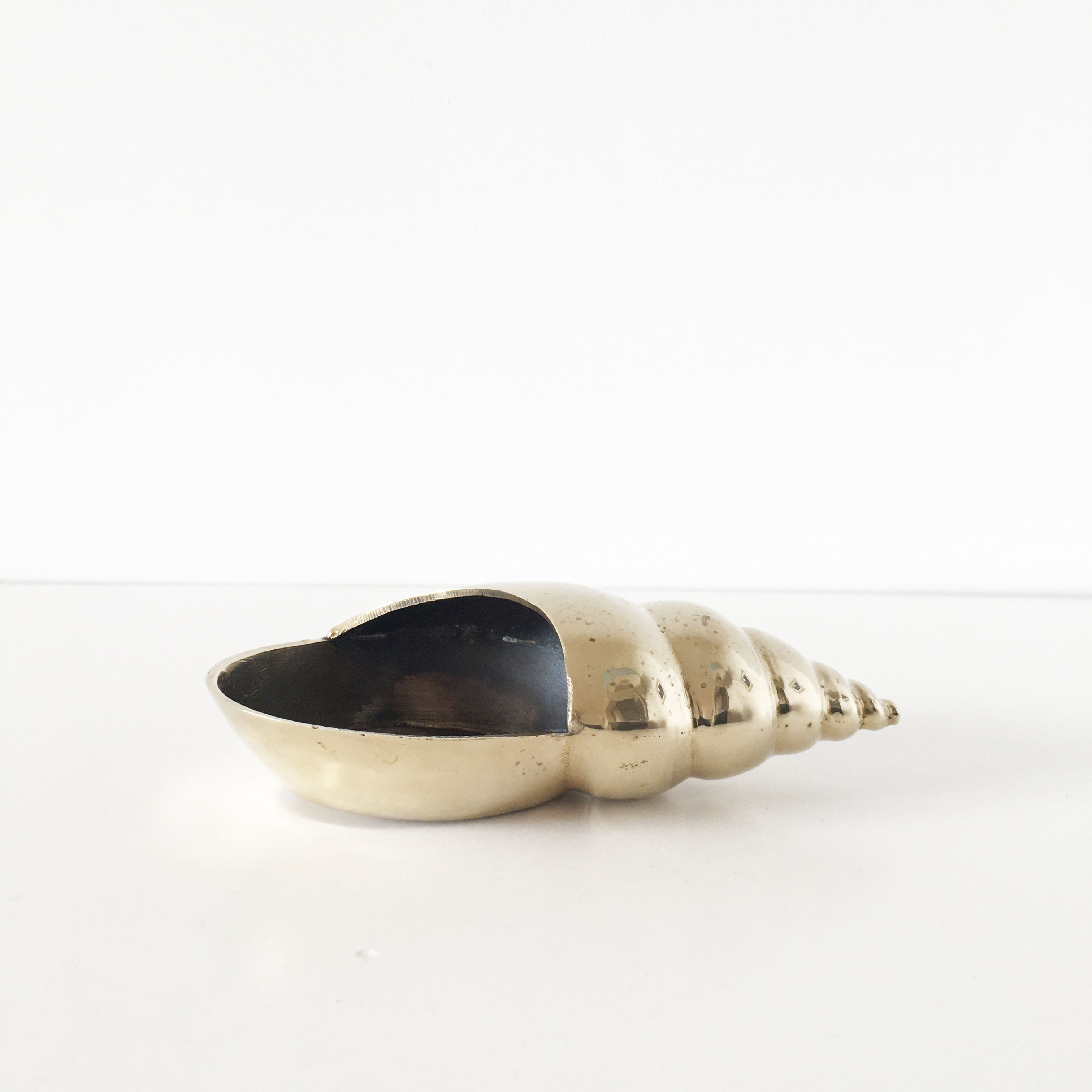 Vintage brass shell ashtray