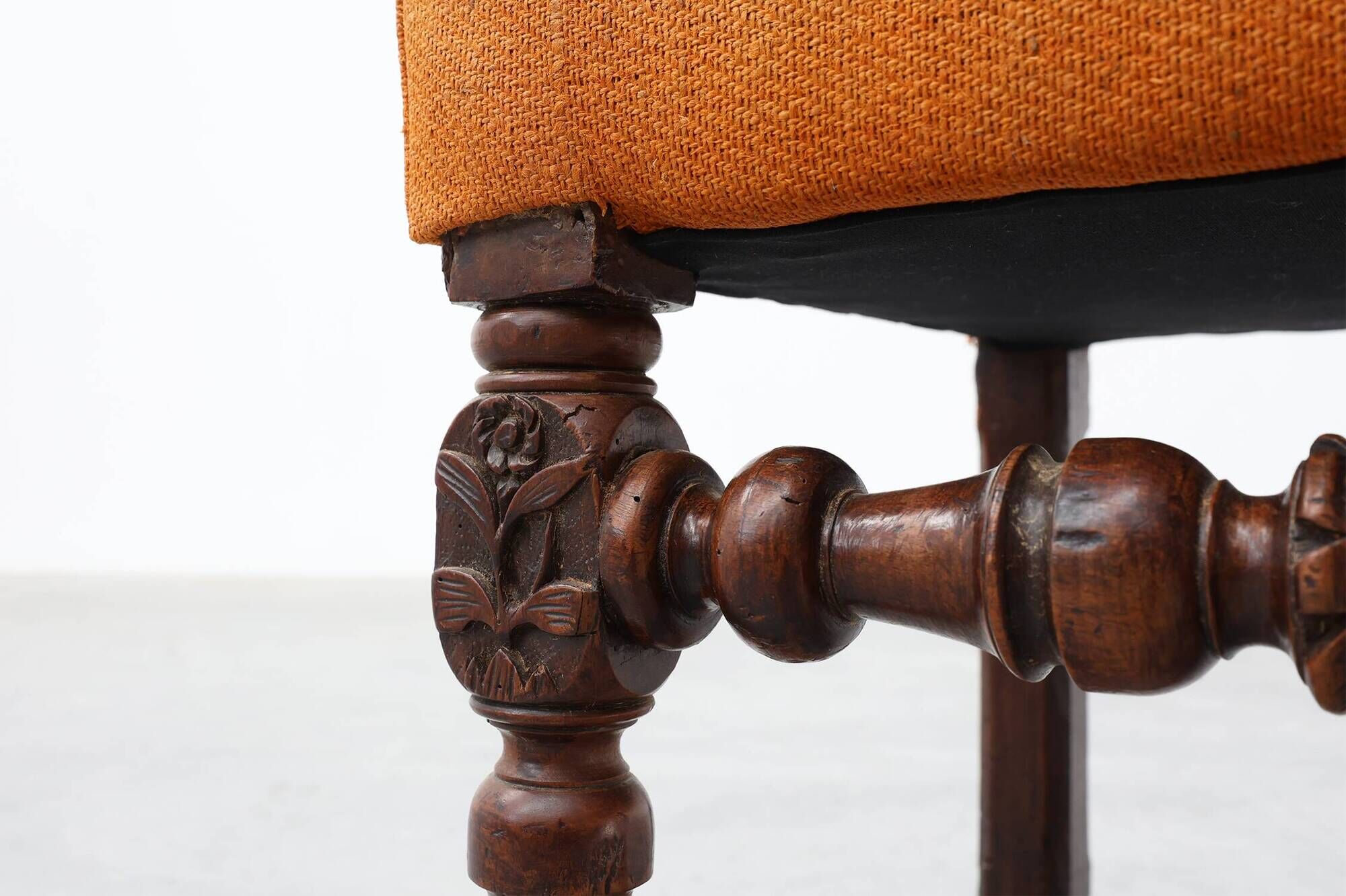 Louis XIII walnut stool with carved turned stretchers and upholstered seat