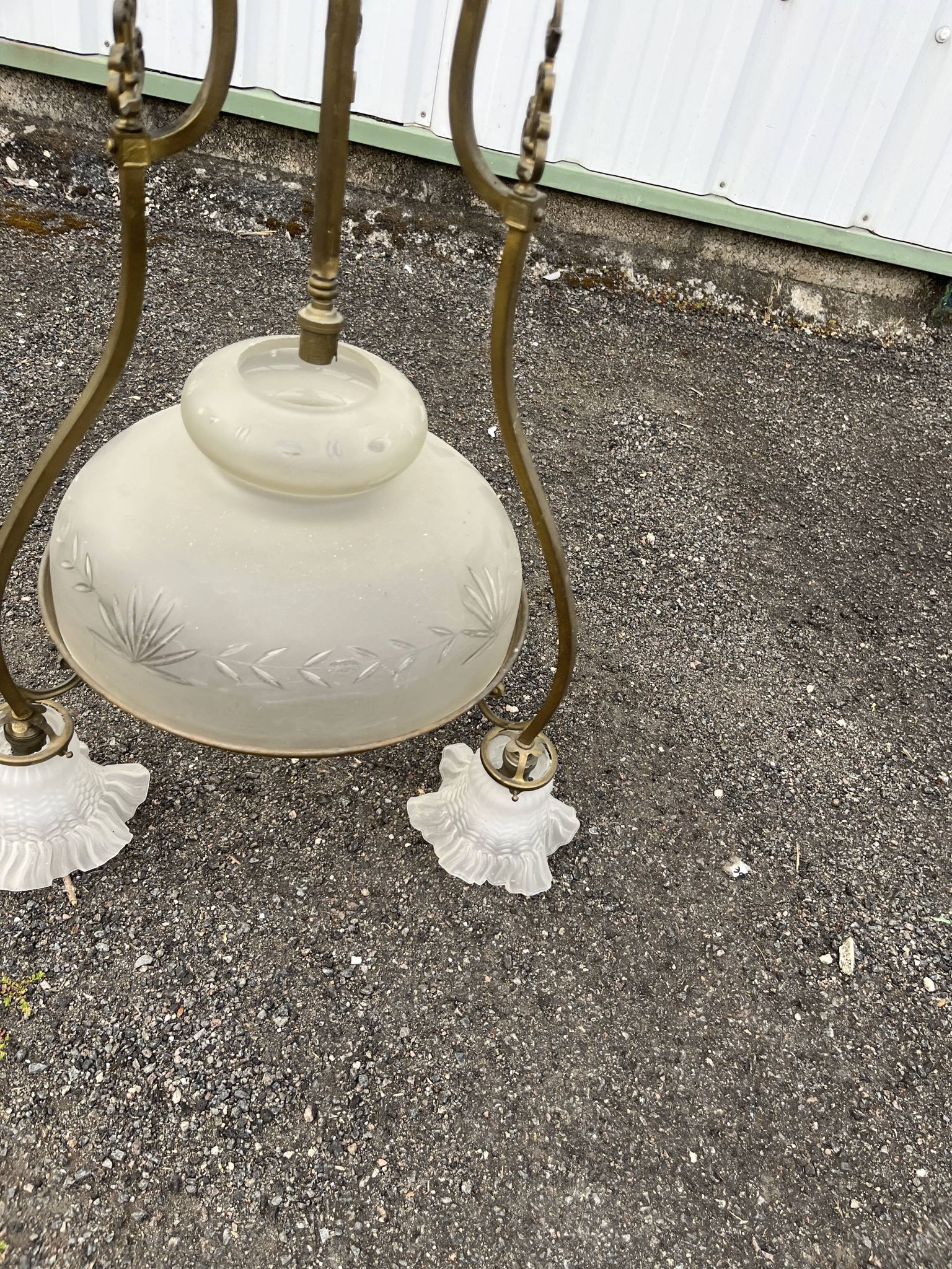 Antique brass chandelier with 3 lights and frosted glass shades.