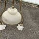 Antique brass chandelier with 3 lights and frosted glass shades.