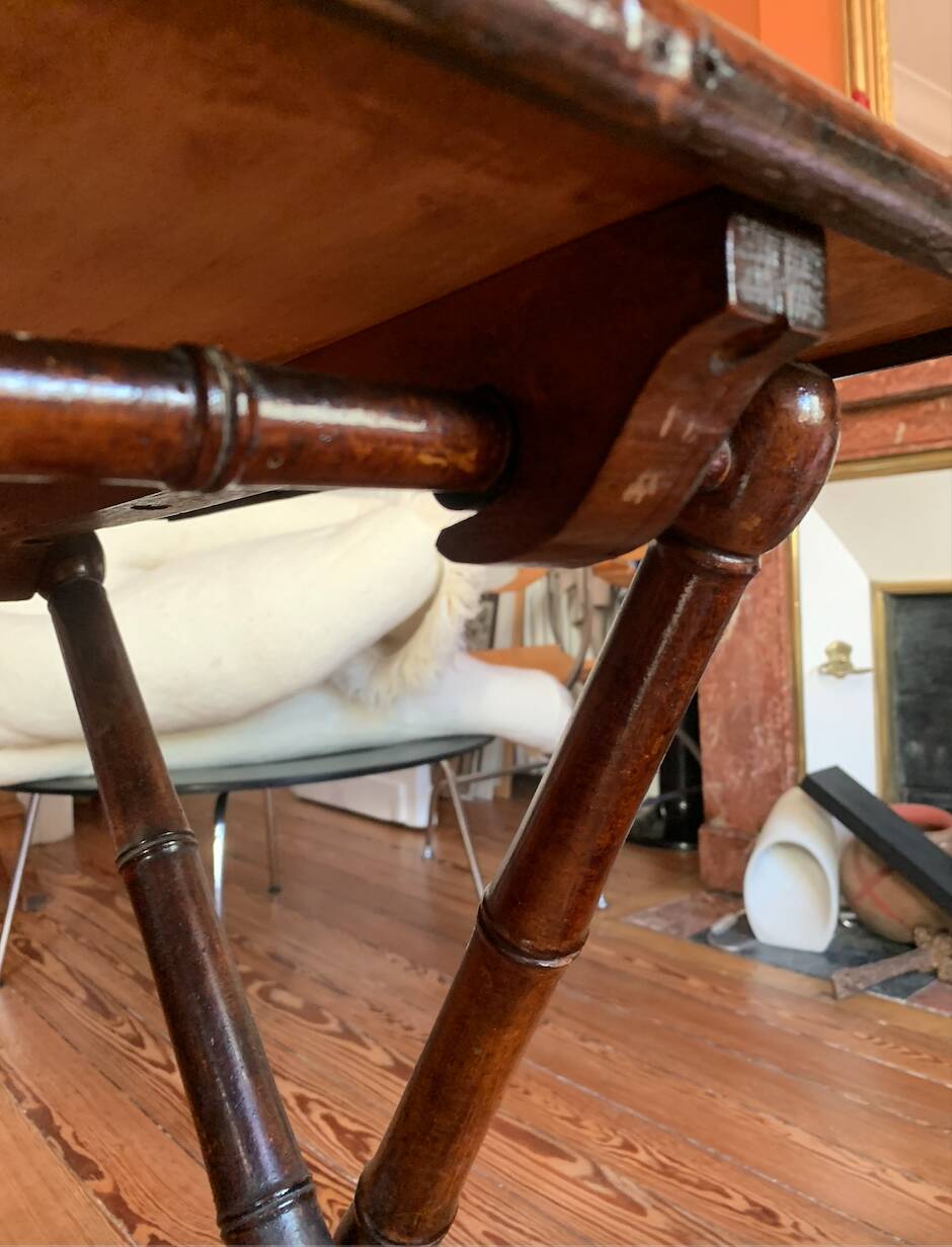 Folding mahogany table with a mirror top.