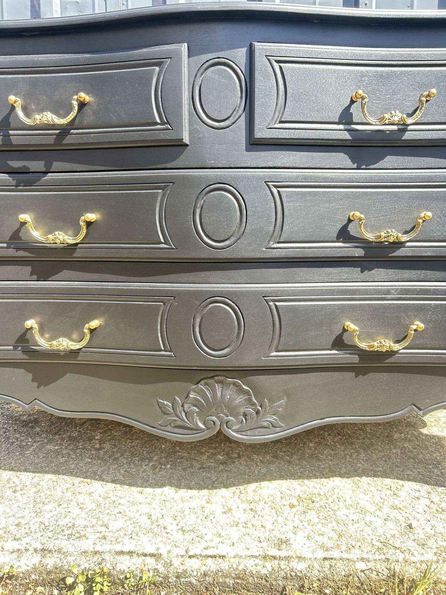 Louis XV style black lacquered chest of drawers with four drawers.