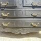 Louis XV style black lacquered chest of drawers with four drawers.