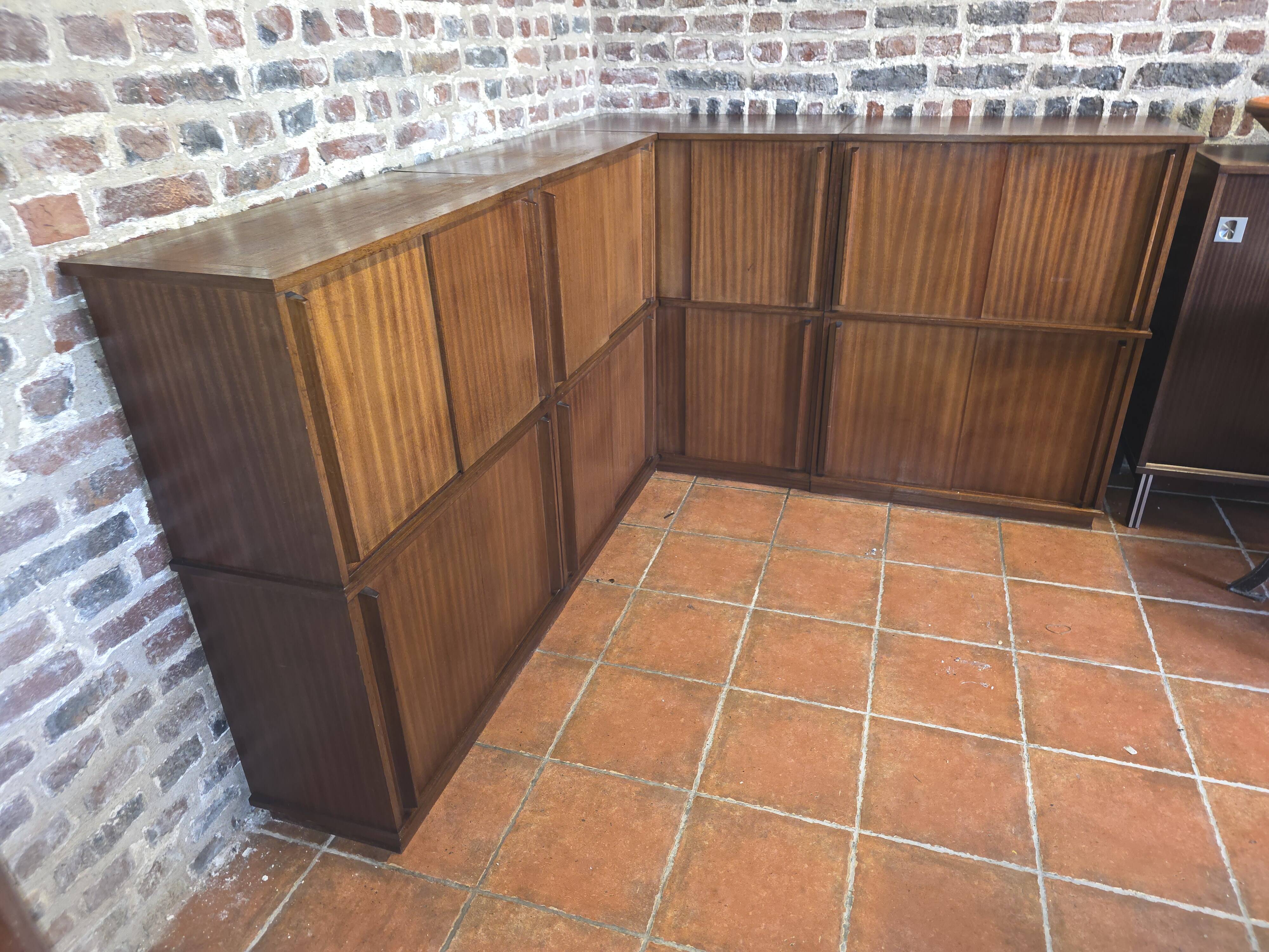 Modular corner library Oscar from the 1960s with sliding doors.