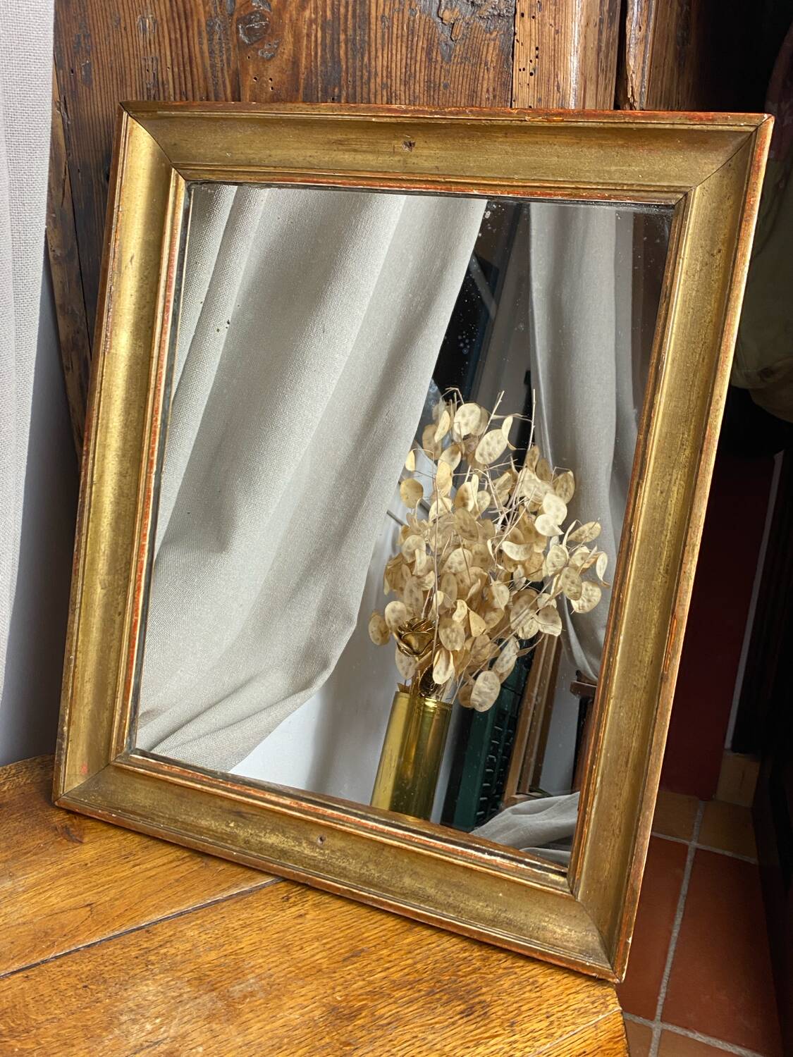 Antique mirror in gilded wood