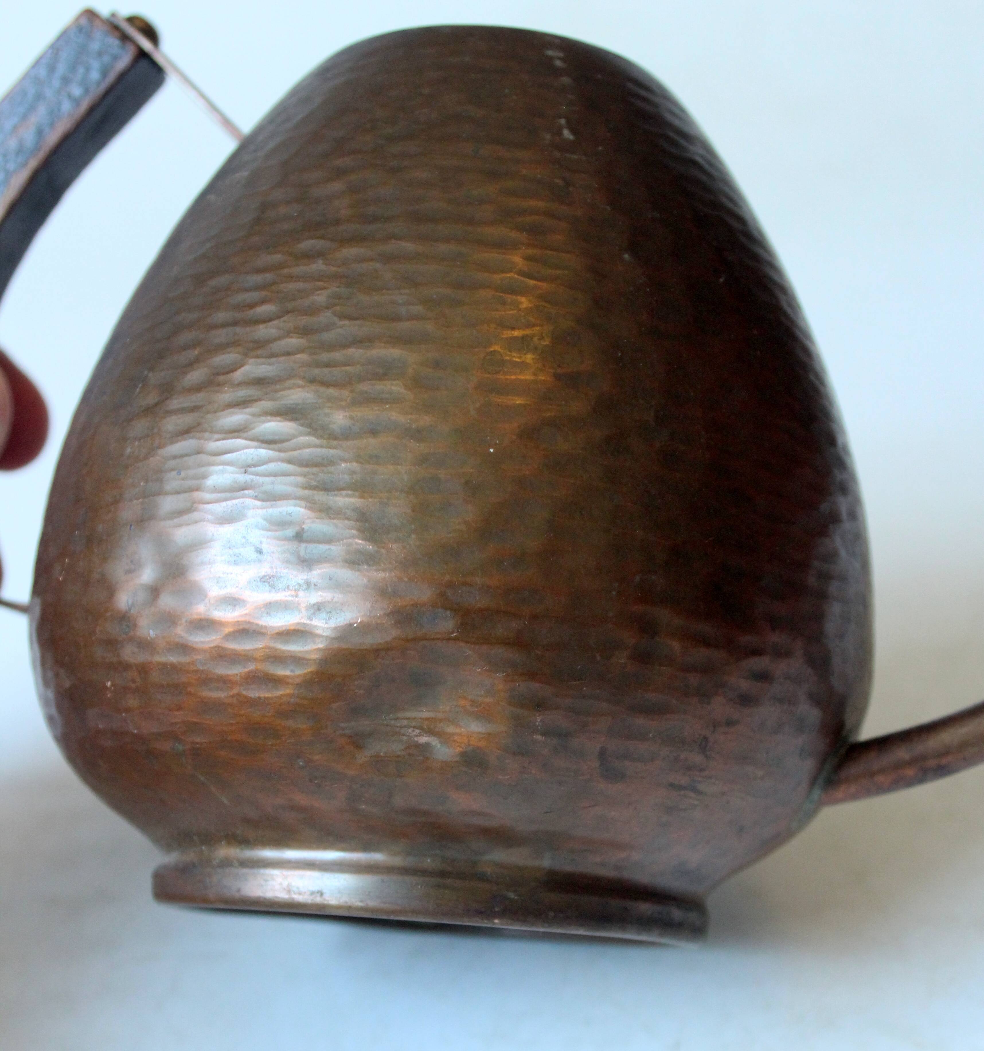 Old copper watering can with wooden handle, complete usuable, vintage from the 1960s