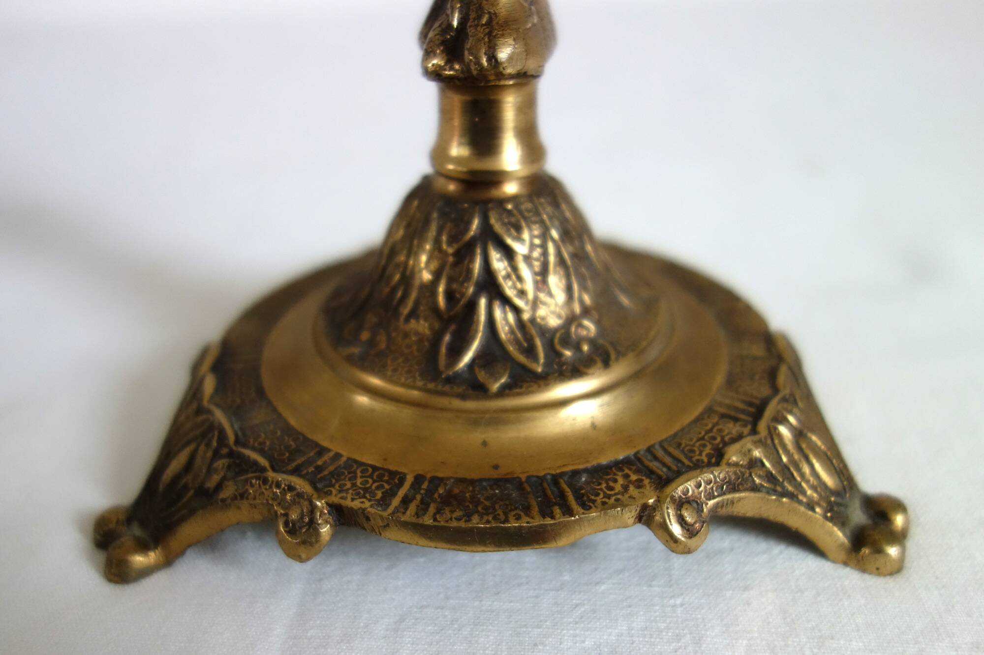 Pair of cherub candle holders in gilded bronze, early 20th century.