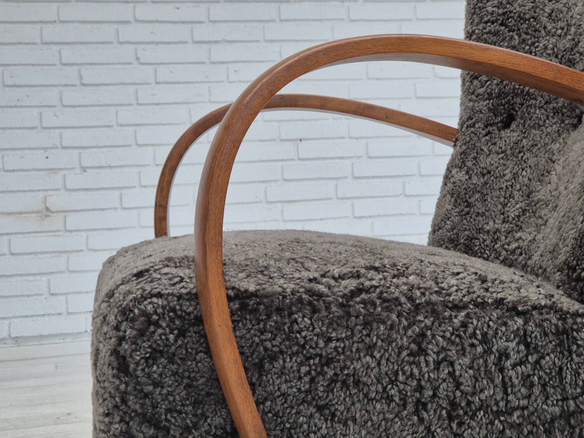 1960s, completely reupholstered Danish art deco armchair, genuine sheepskin "Wellington".