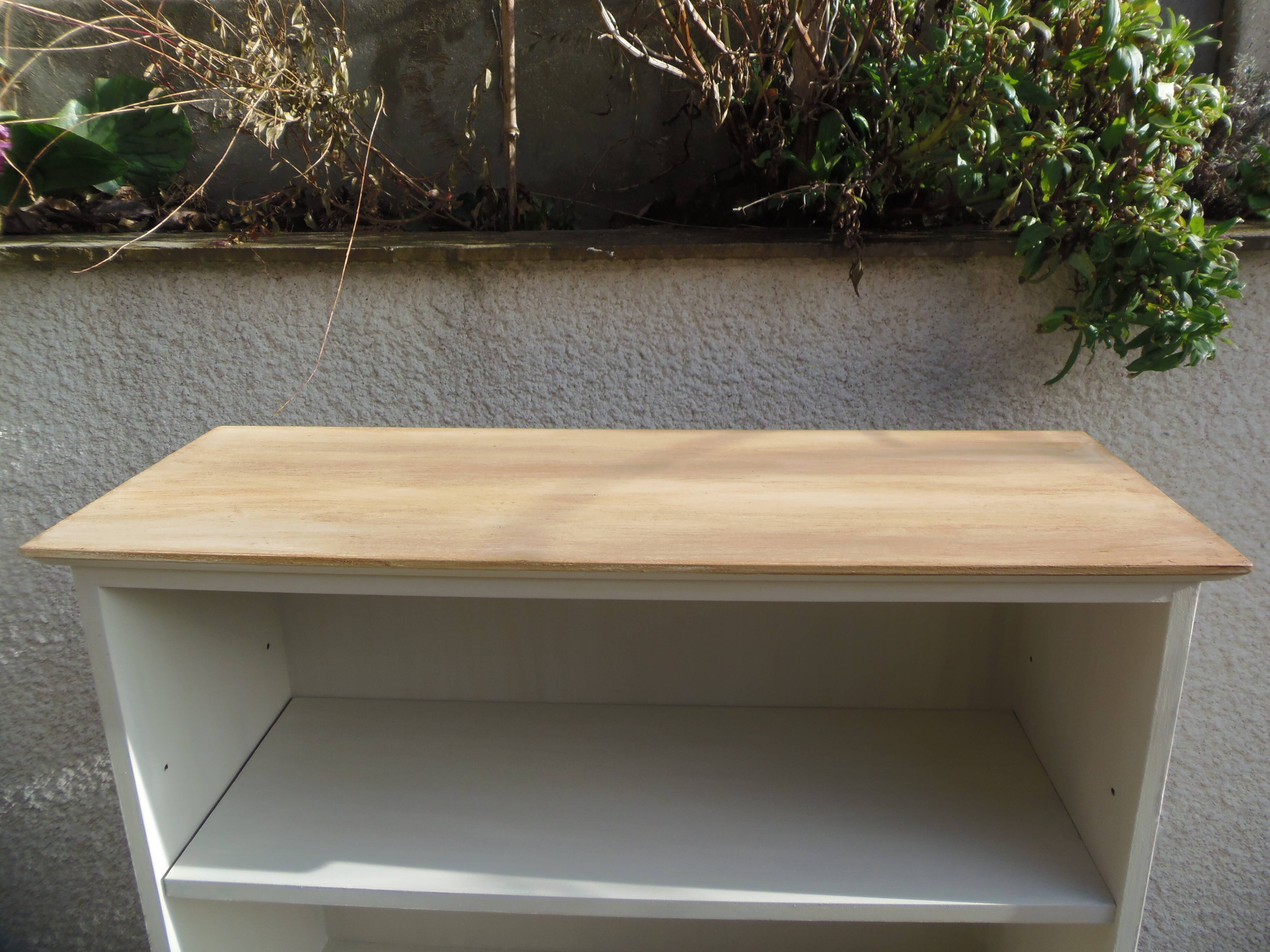 Vintage library enhanced in beige, wooden top.