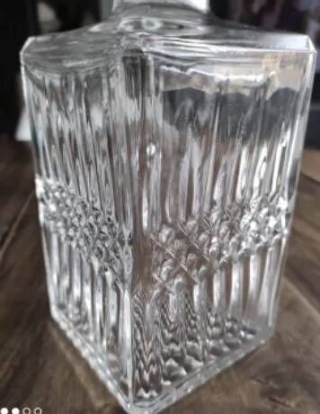 Vintage whiskey decanter in diamond faceted glass airtight stopper