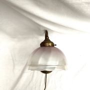 Brass wall light with a glass globe dimension: height -21cm- width -27cm-