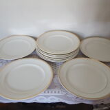 Set of 11 flat white earthenware plates with gold edging