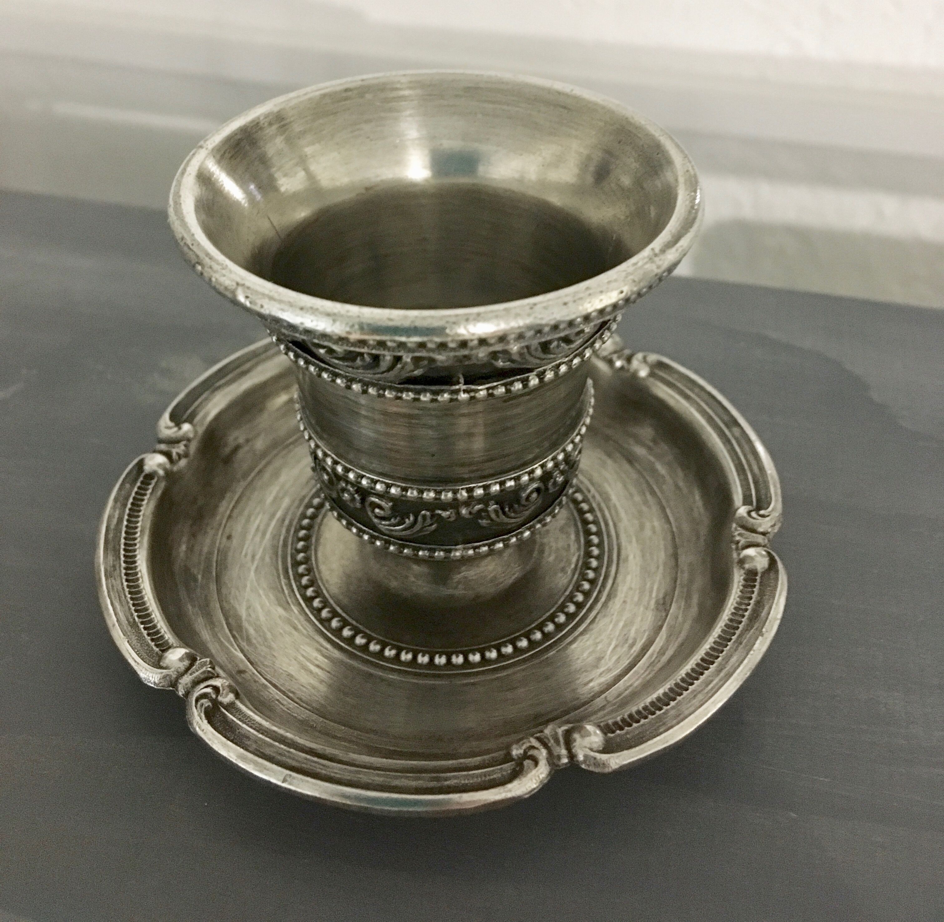 Chiseled silver metal candle holder
