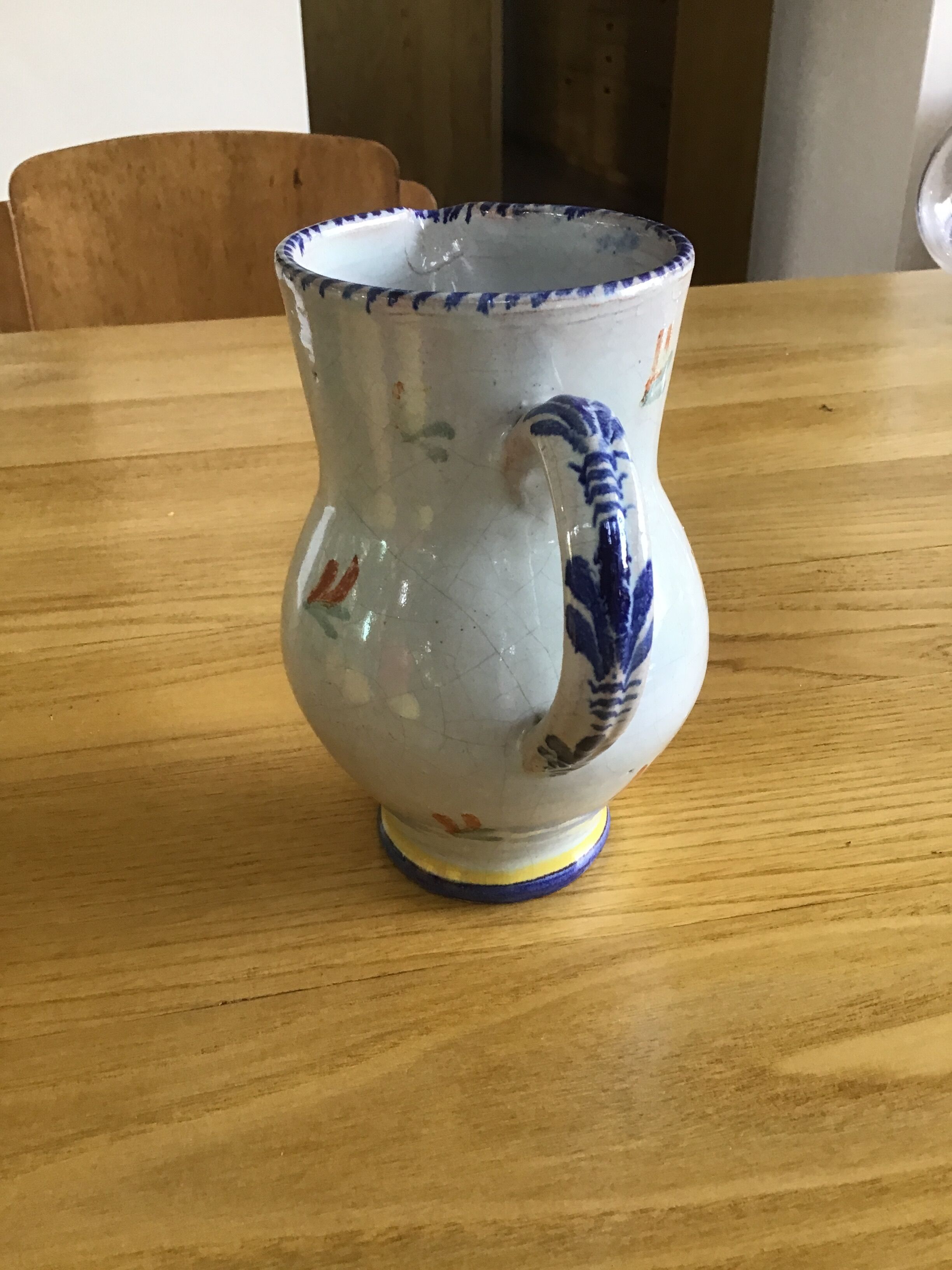 Earthenware pitcher with blue decor