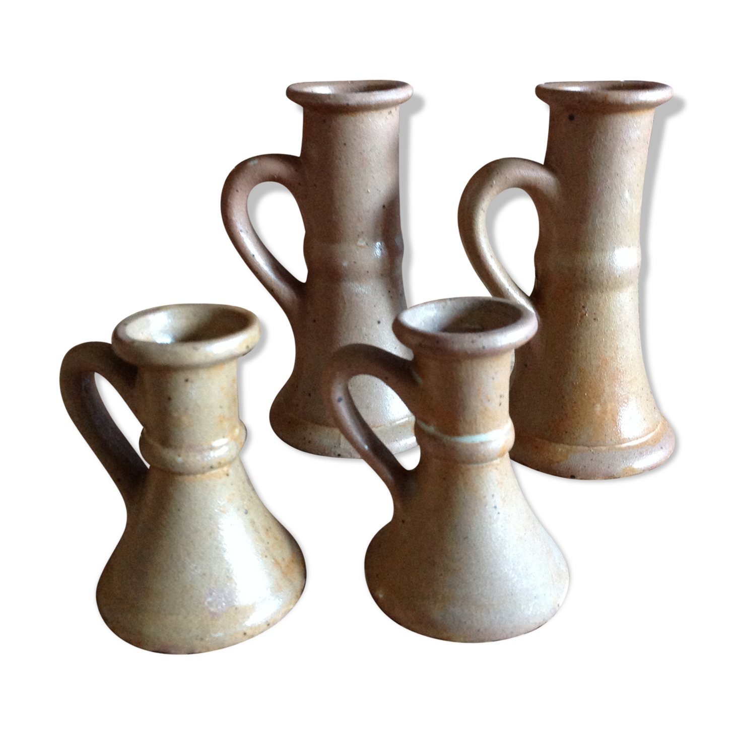 Set of 4 candlesticks in sandstone