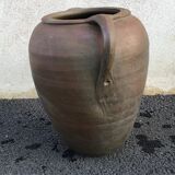 Old jug with two sandstone handles