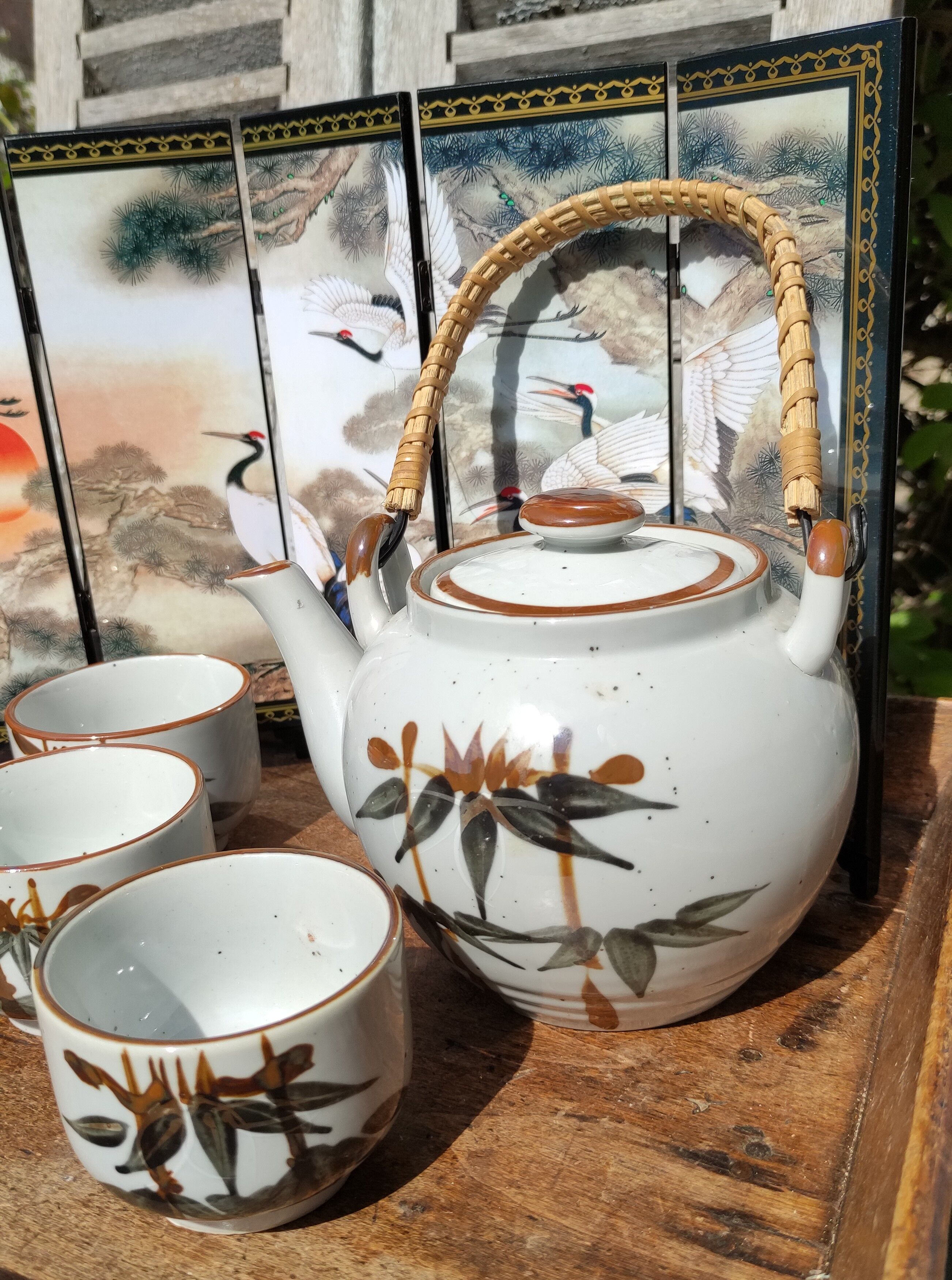 Asian set of a teapot and its cups