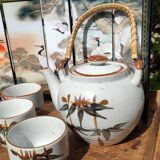 Asian set of a teapot and its cups