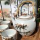 Asian set of a teapot and its cups