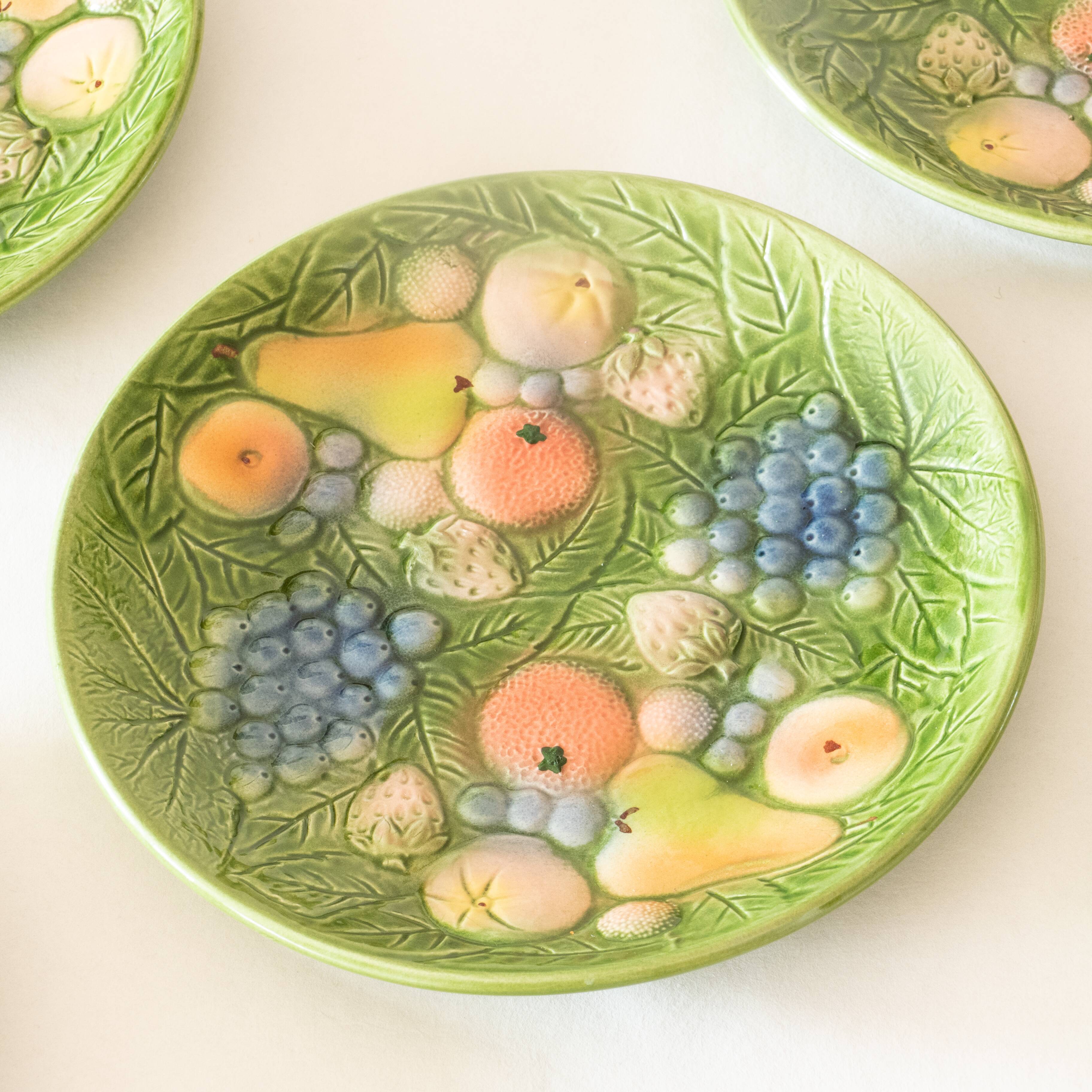 10 antique plates in fruit slip