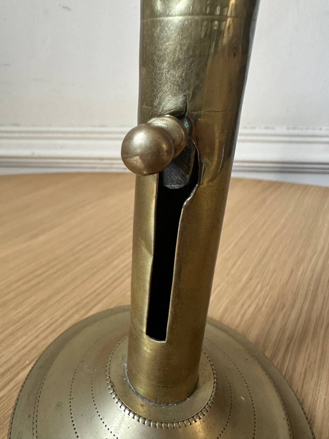 Old brass pull candle holder