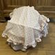1960s wicker cradle with mattress and drapes.