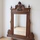 Antique wooden commode with marble top and mirror.